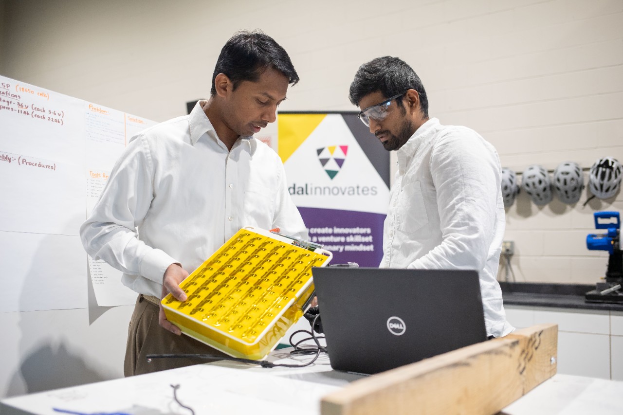 Two engineers looking at equipment.