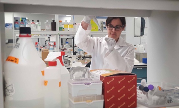 Dr. Jeanette Boudreau working in a lab.