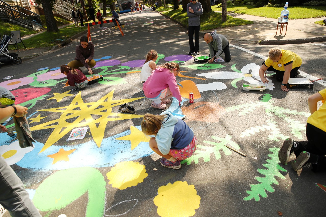 Photo by Cody Turner, 2024 Community members painting a street mural