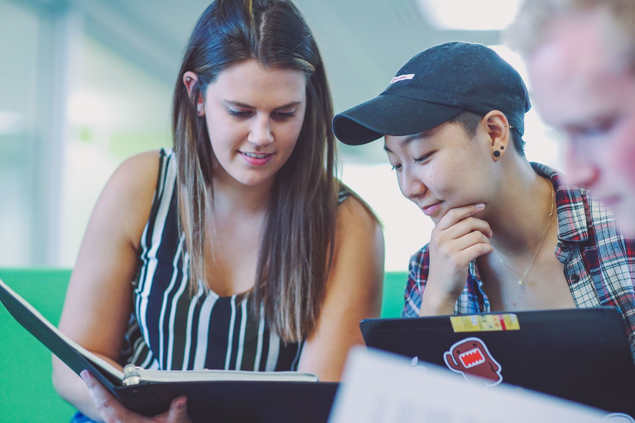 2 students collaborating with their computers Recruitment Campaign 2021