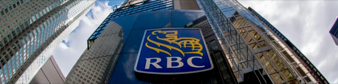 Cropped view of an RBC building tower with sign.