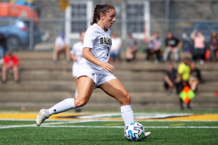 Chiasson in action on the soccer field with the ball.