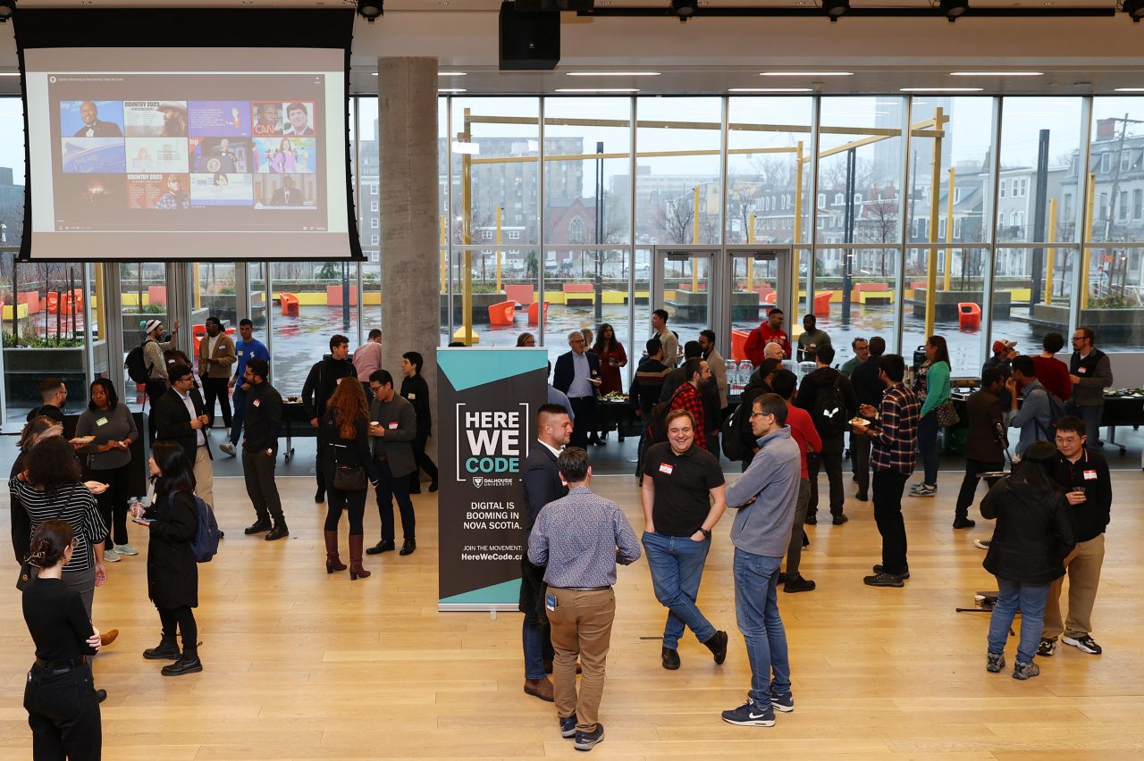 People mingle in the lobby of the Halifax Public Library.