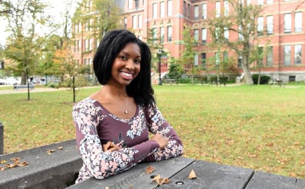Dr. Keisha Jefferies sits at a picnic table on Dalhousie’s Carleton Campus.
