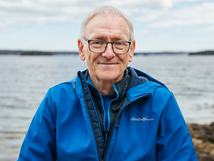 Geologist Fred Bonner stands outside near beach in rural Nova Scotia.