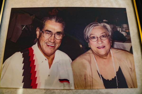 A photo of a man wearing a white shirt and a woman wearing a brown jacket